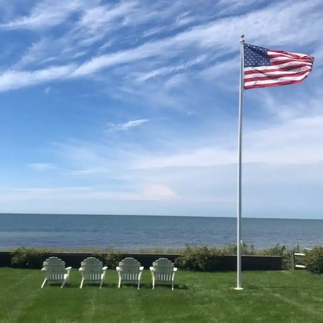 Excavator operating next to a metal guardrail